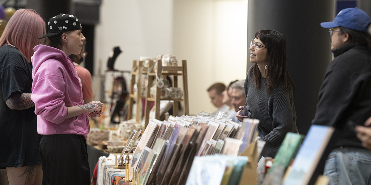 Guests chat with Indigenous artist Alanah Jewell at her MarketFest booth